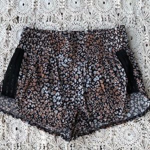 free people cheetah print with black lace design